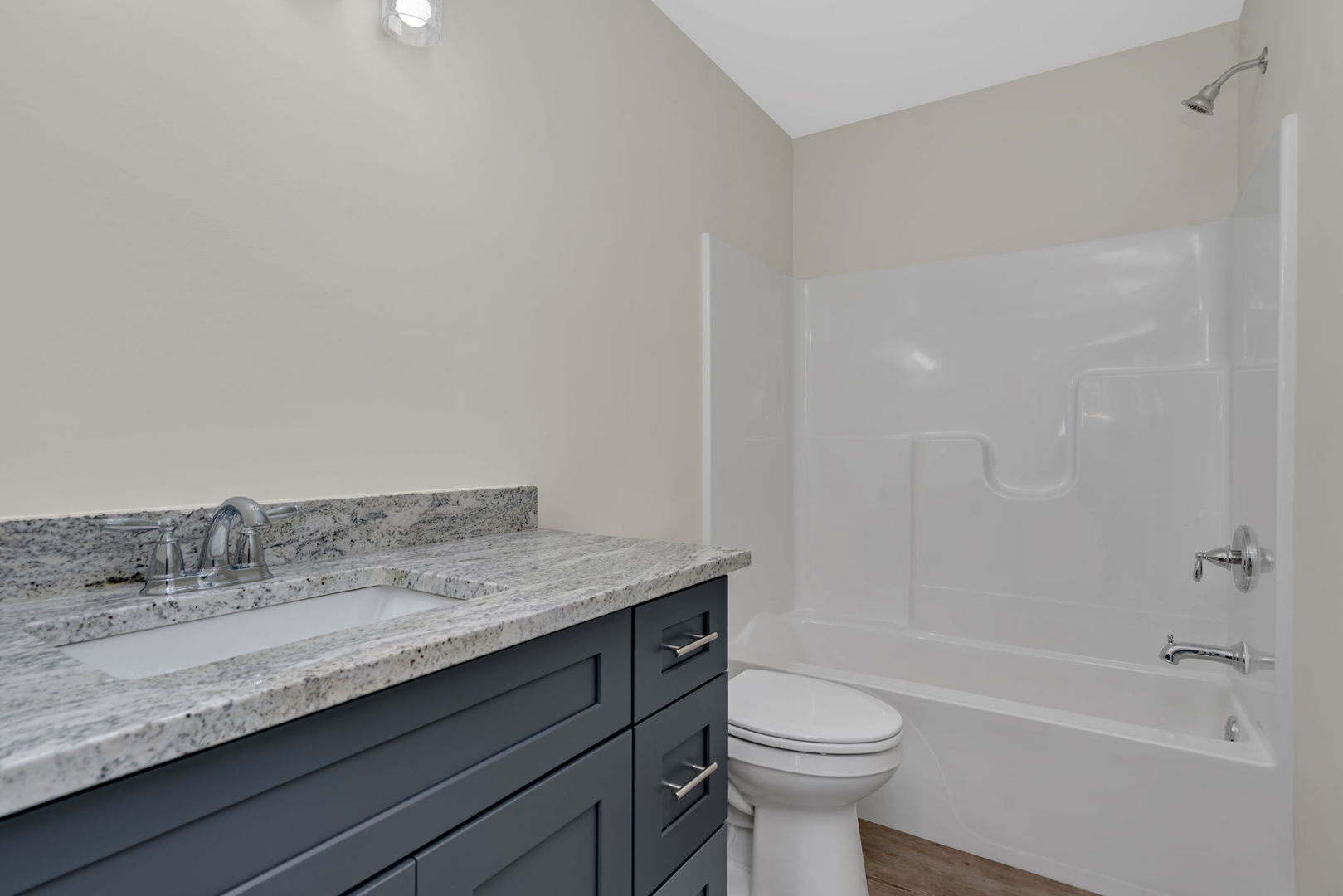 903 Springhill Drive Coal City, IL 60416 - Photo 21 of 37 a bathroom with a granite countertop sink a toilet and bathtub