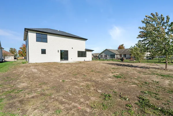 a view of front of house with a yard