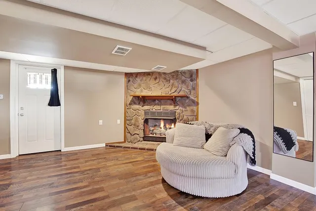 a bedroom with a bed and a mirror