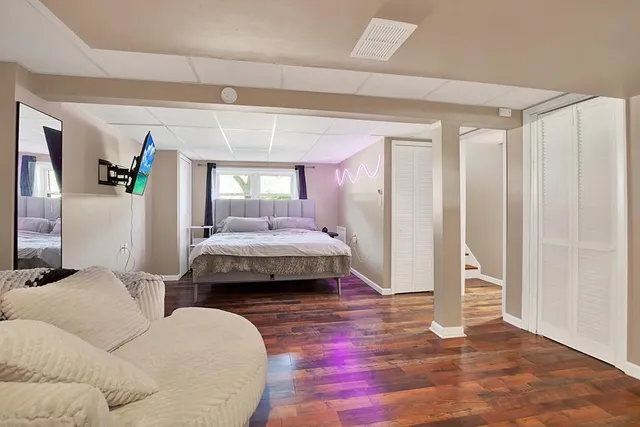 a bedroom with a bed and window