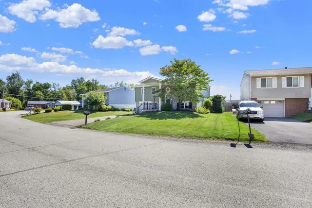 an aerial view of a house with a garden