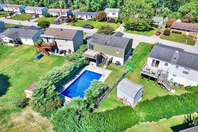 an aerial view of residential house with outdoor space and street view