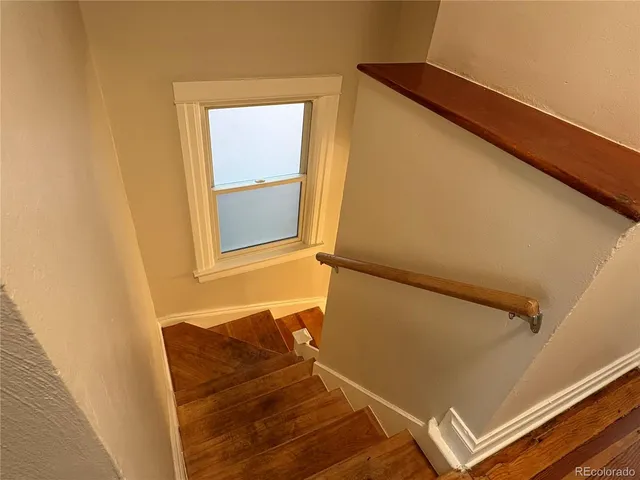 a kitchen with stainless steel appliances a refrigerator sink and cabinets