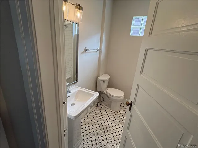 an empty room with wooden floor and closet