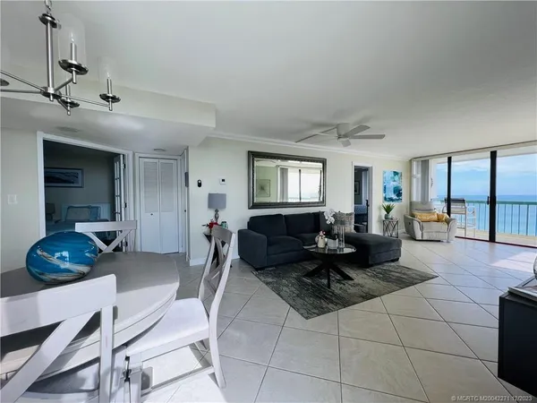 a bedroom with furniture and a flat screen tv