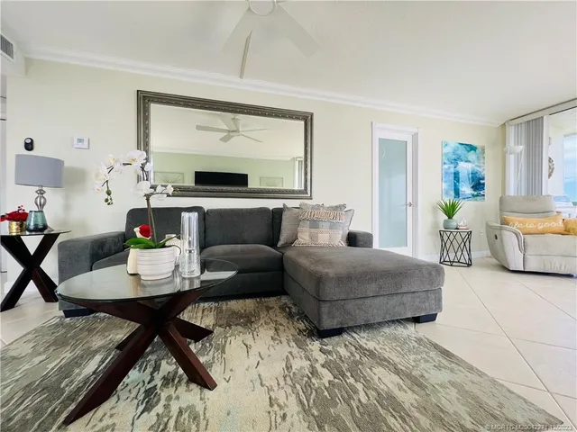 a bathroom with a granite countertop sink a toilet a mirror and shower
