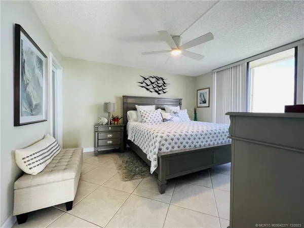 a view of a house with a swimming pool and a yard