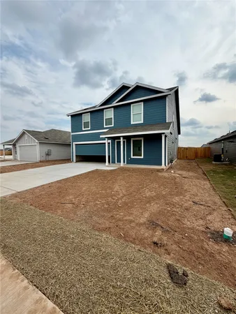 a house view with swimming pool in front of it