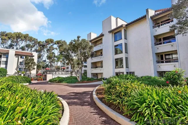 a view of a building with a yard