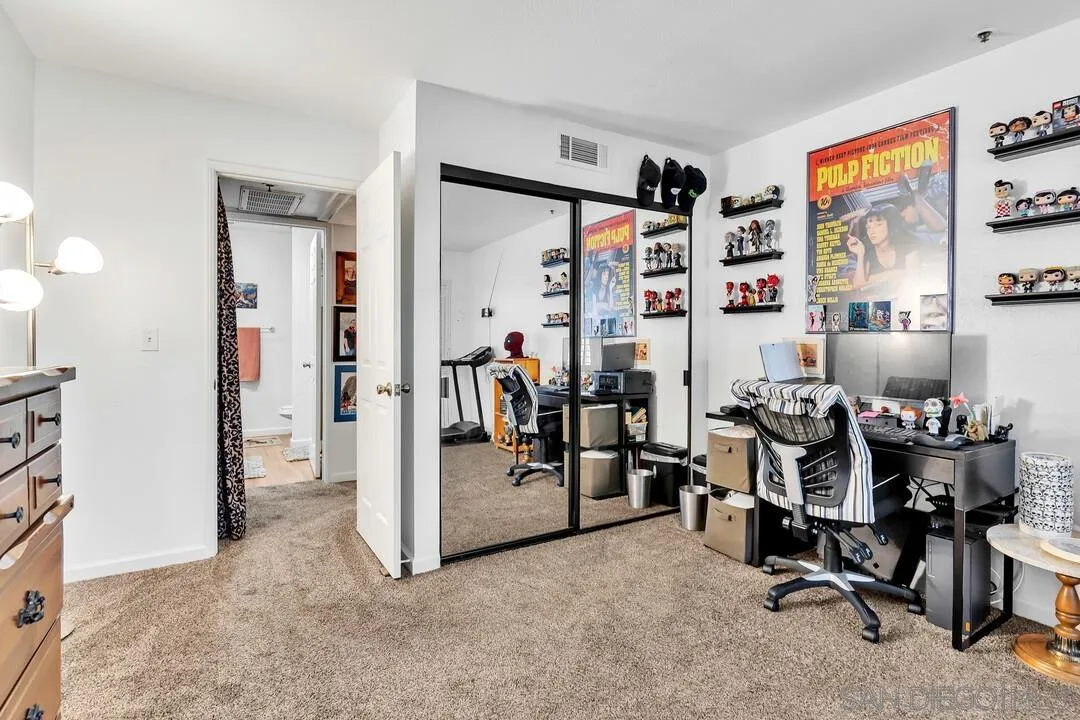 5745 Friars Road, Unit 104 San Diego, CA 92110 - Photo 21 of 37 a view of a livingroom with workspace and a window