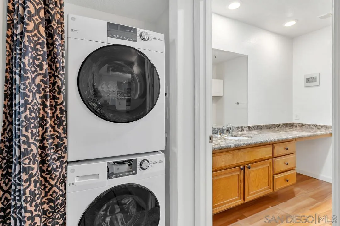 5745 Friars Road, Unit 104 San Diego, CA 92110 - Photo 28 of 37 a view of a kitchen with washer and dryer
