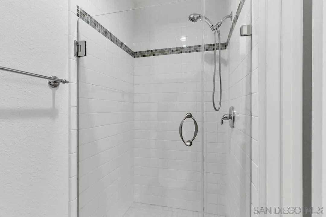 5745 Friars Road, Unit 104 San Diego, CA 92110 - Photo 29 of 37 a bathroom with a shower