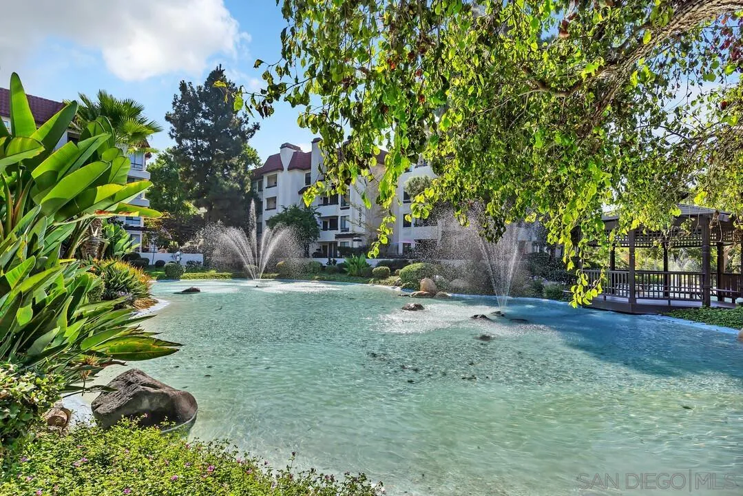 5745 Friars Road, Unit 104 San Diego, CA 92110 - Photo 33 of 37 a backyard of a house with a tree