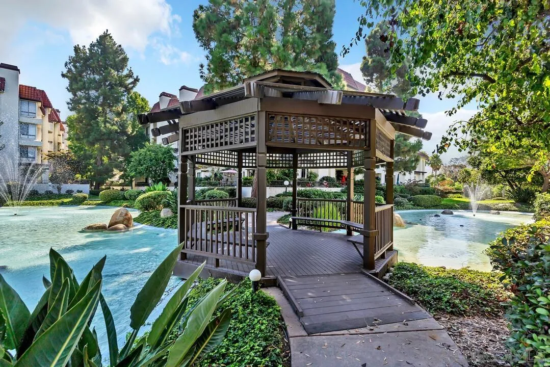 5745 Friars Road, Unit 104 San Diego, CA 92110 - Photo 35 of 38 a view of a table and chairs in patio of the house