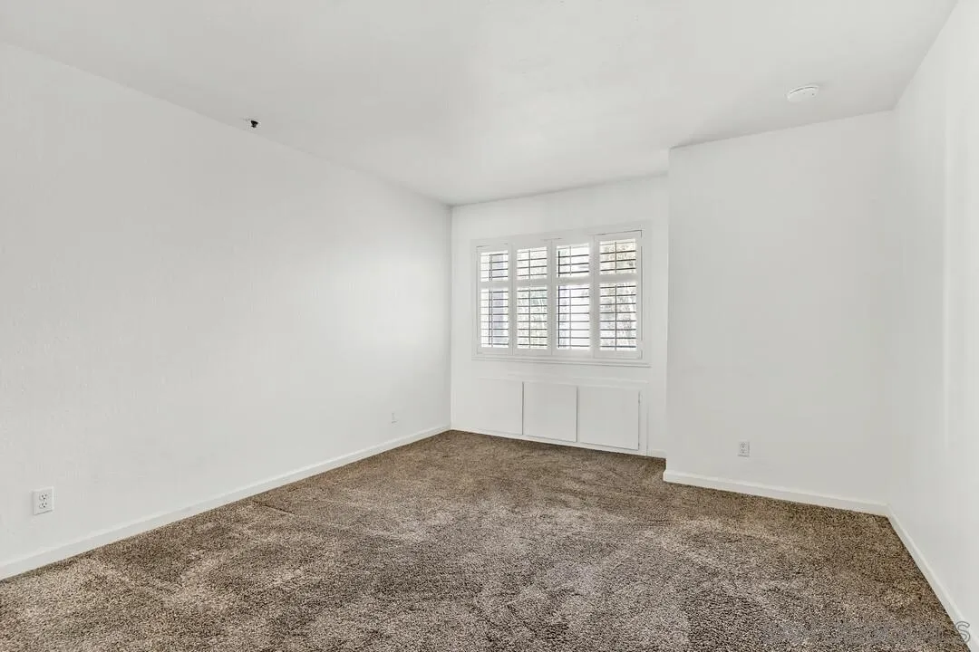 5745 Friars Road, Unit 104 San Diego, CA 92110 - Photo 6 of 38 an empty room with a window