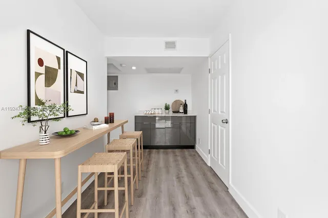a bathroom with a sink a mirror and a window
