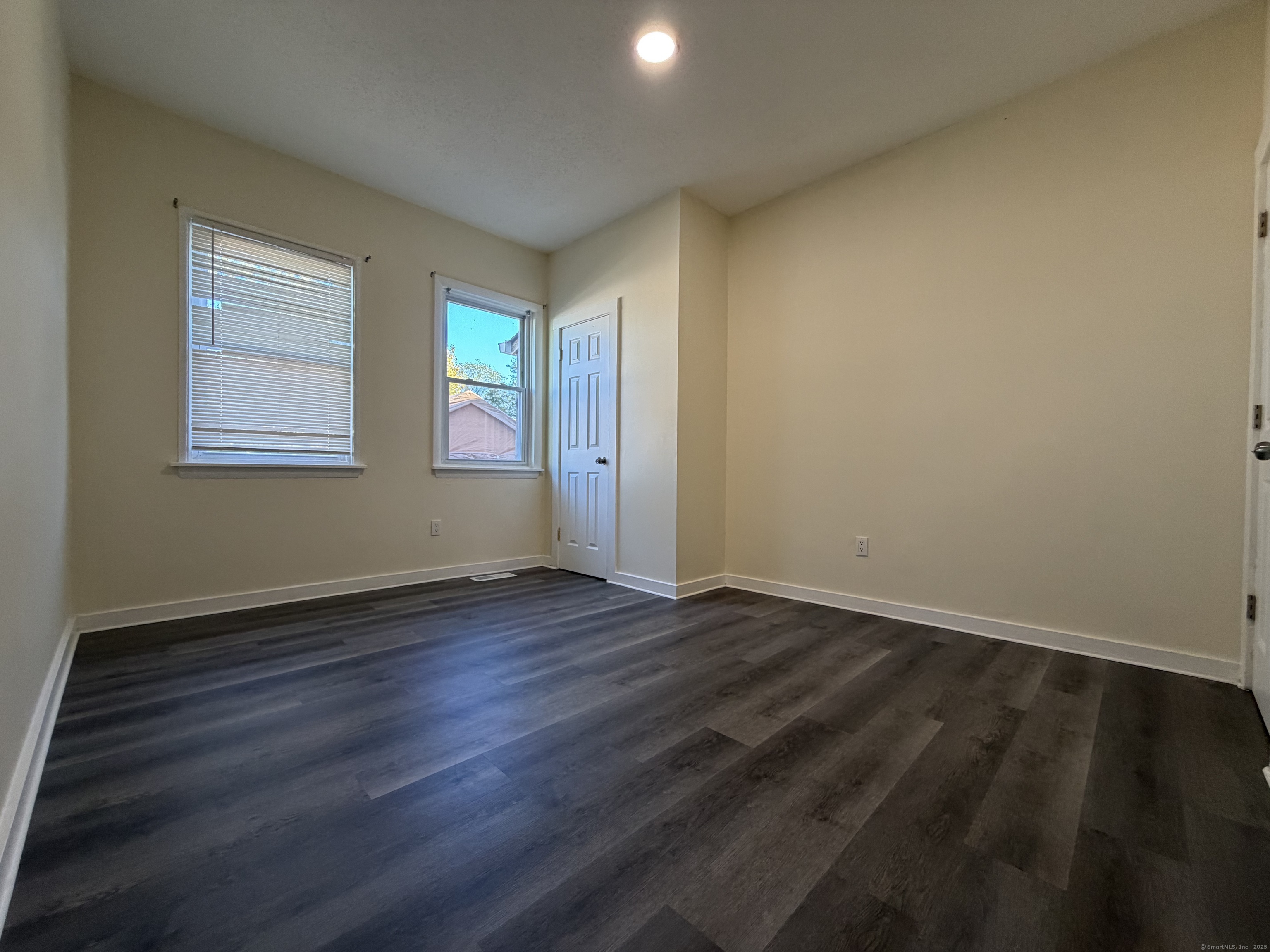 13 Lines Street New Haven, CT 06519 - Photo 12 of 12 an empty room with wooden floor and windows