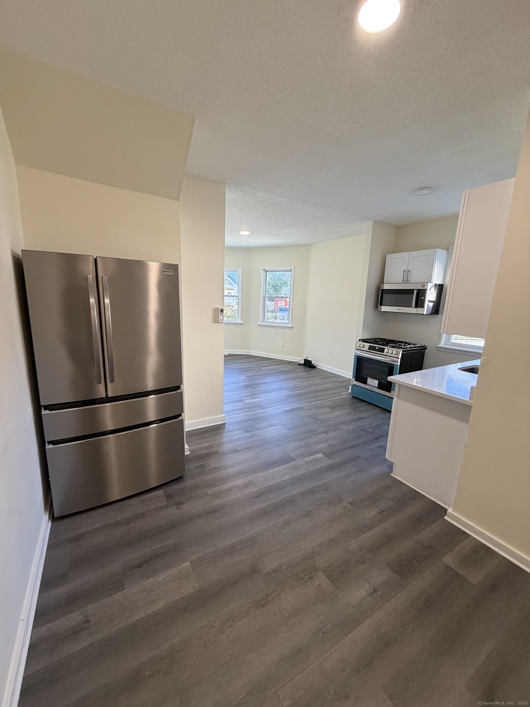 13 Lines Street New Haven, CT 06519 - Photo 4 of 12 a kitchen with stainless steel appliances a refrigerator and a stove top oven