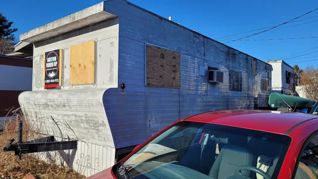 a view of a house with wooden stairs