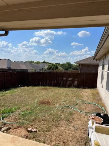 a view of balcony with furniture