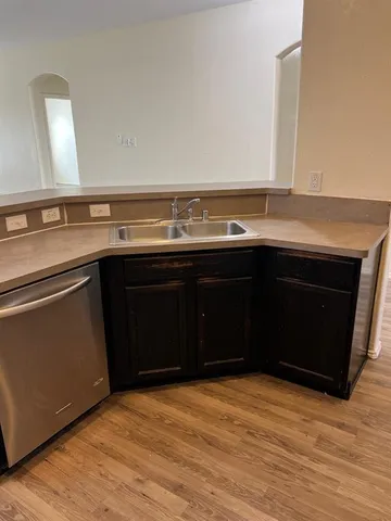 a kitchen with a sink and a stove