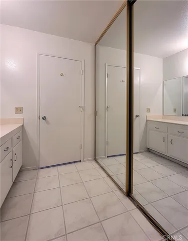 a view of a bathroom with mirror