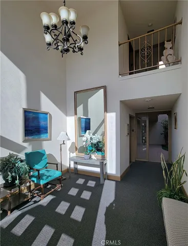 a living room with furniture flowerpot and flower pot