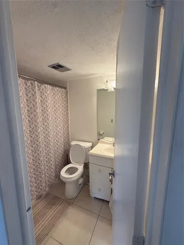 a room with furniture and a floor to ceiling window