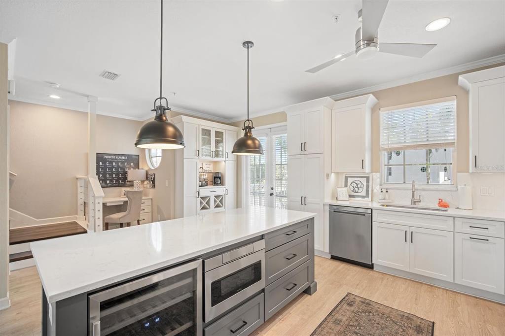135 Bath Club Circle North Redington Beach, FL 33708 - Photo 12 of 45 a kitchen with counter top space cabinets and appliances