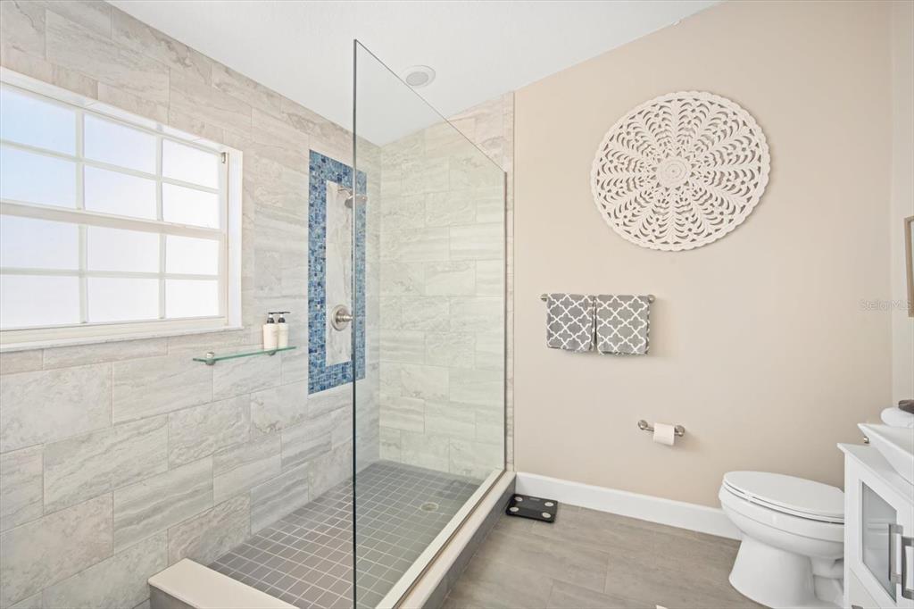 135 Bath Club Circle North Redington Beach, FL 33708 - Photo 19 of 45 a bathroom with a toilet and a shower
