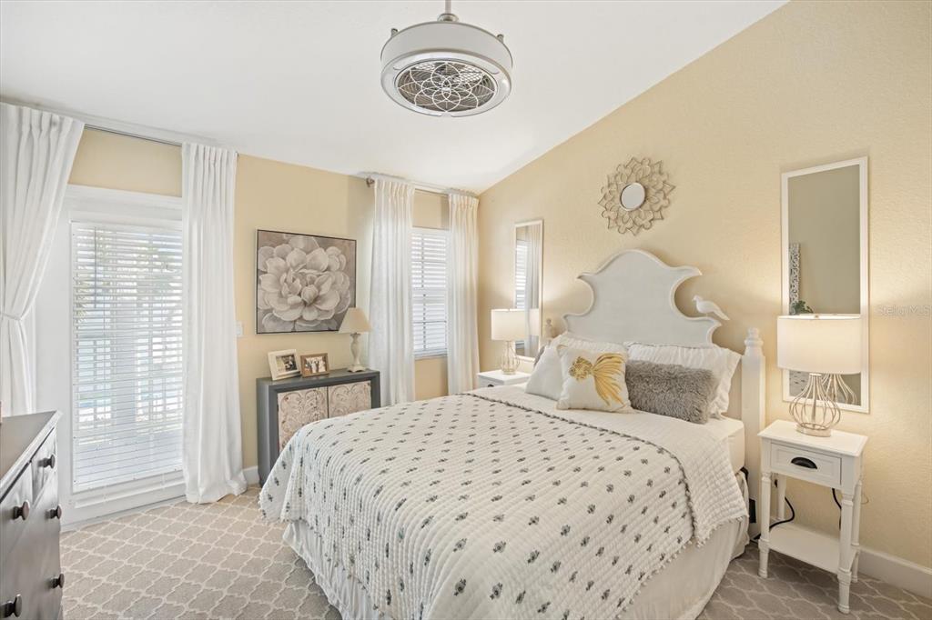 135 Bath Club Circle North Redington Beach, FL 33708 - Photo 22 of 45 a bedroom with a bed and a table