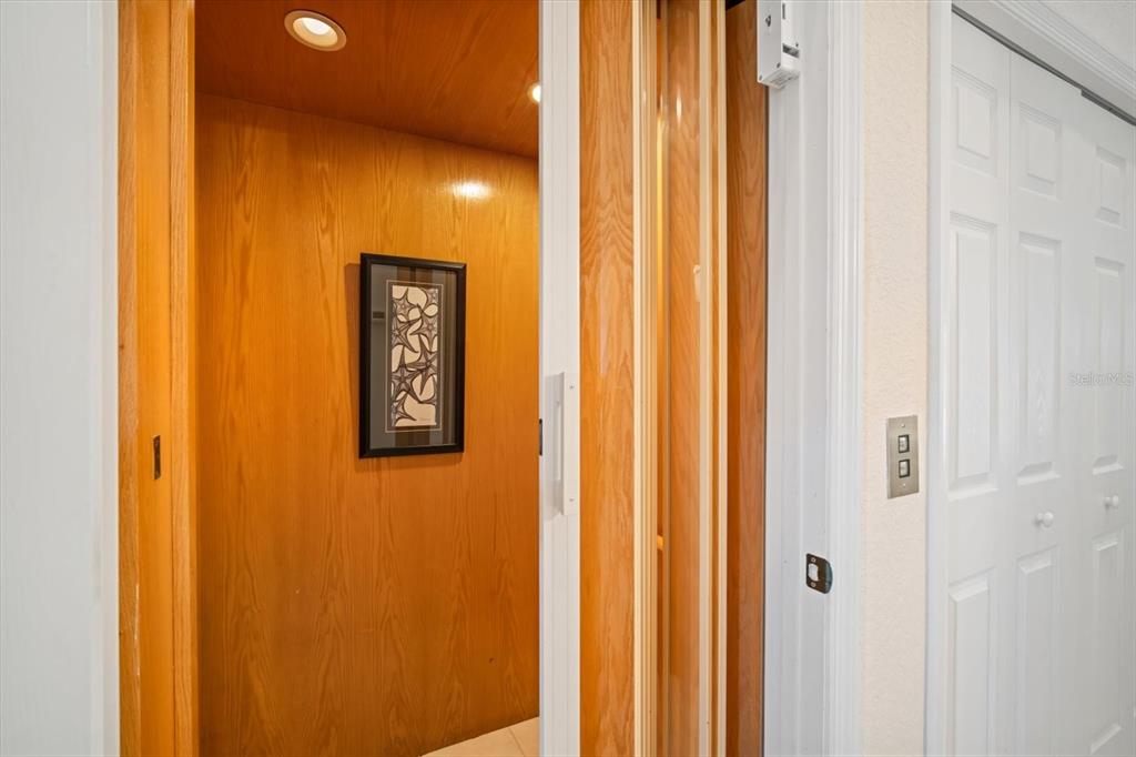135 Bath Club Circle North Redington Beach, FL 33708 - Photo 27 of 45 a view of a hallway with elevator