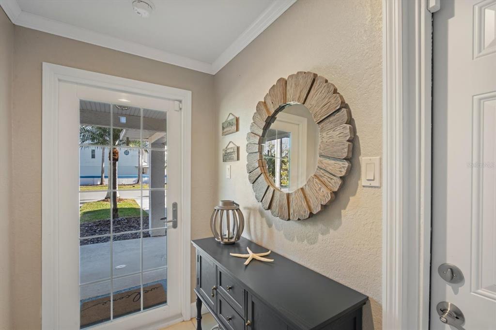 135 Bath Club Circle North Redington Beach, FL 33708 - Photo 29 of 45 a view of a entryway with a front door