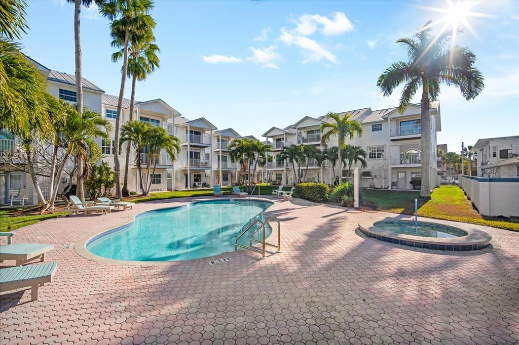 135 Bath Club Circle North Redington Beach, FL 33708 - Photo 33 of 45 a view of outdoor space with swimming pool and seating