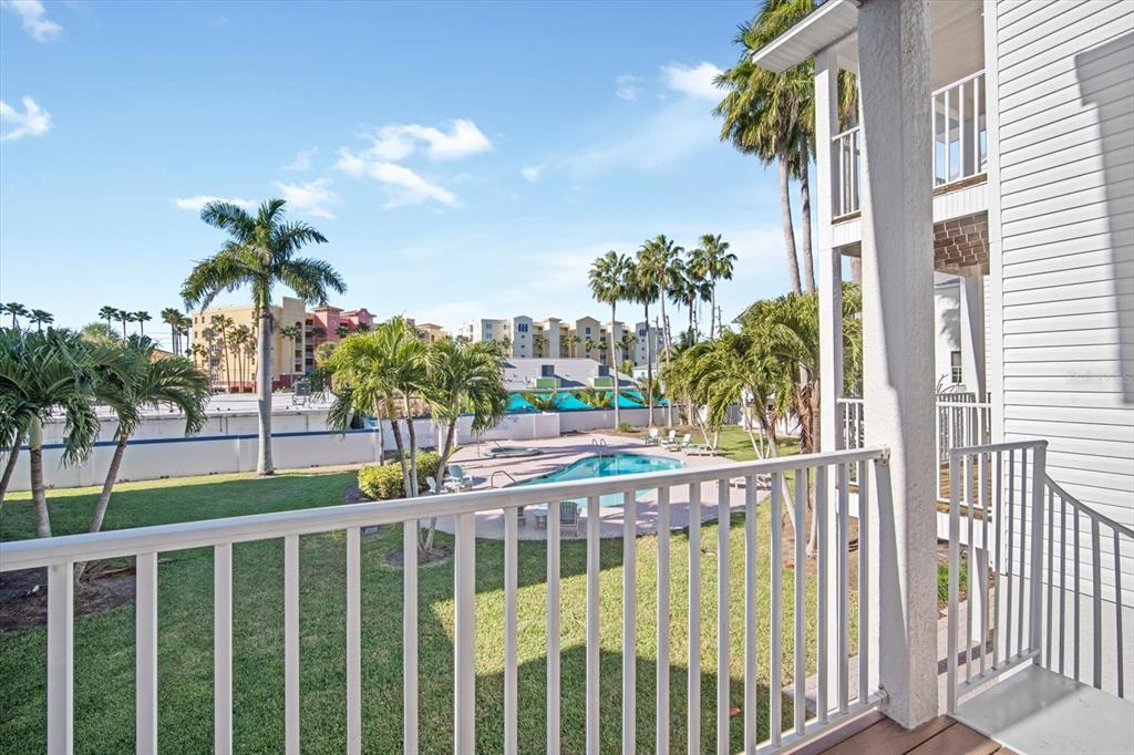 135 Bath Club Circle North Redington Beach, FL 33708 - Photo 7 of 45 a view of balcony with small garden