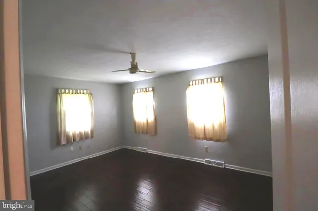 a view of an entryway with wooden floor