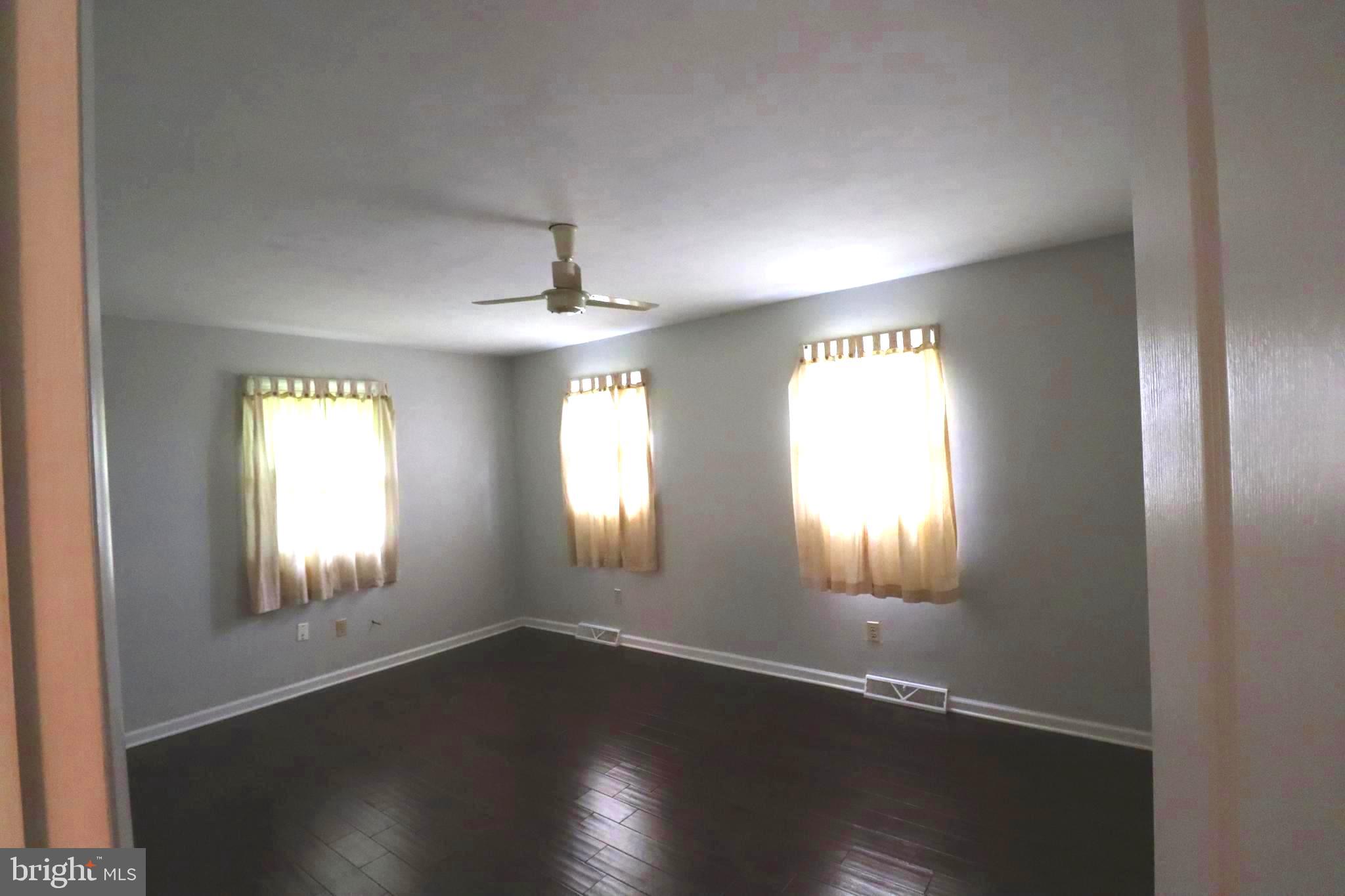 49 Valley View Drive Hanover, PA 17331 - Photo 27 of 64 an empty room with wooden floor and windows