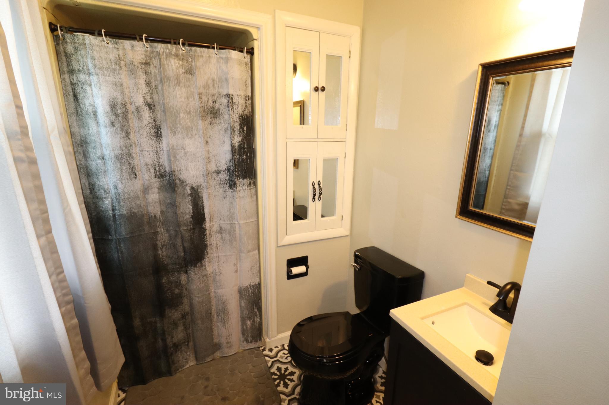 49 Valley View Drive Hanover, PA 17331 - Photo 54 of 64 a bathroom with a sink and a mirror