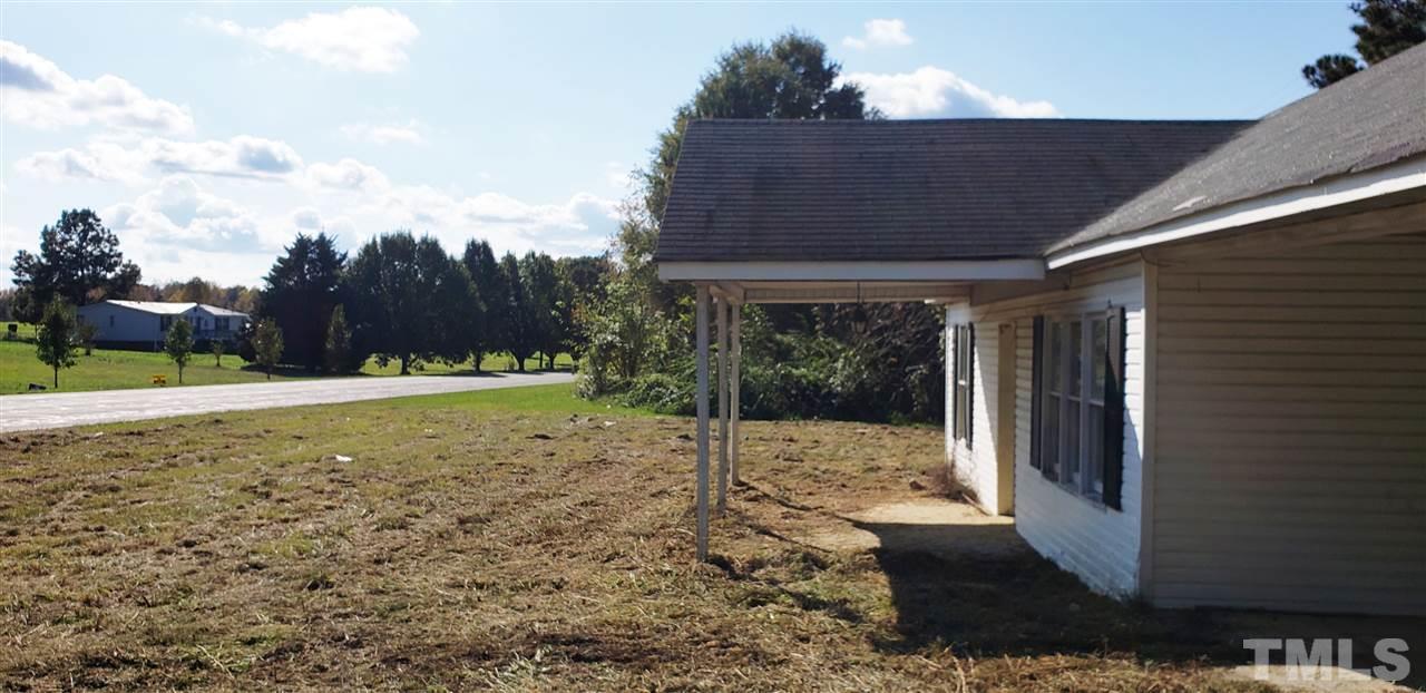 1195 Concord Ceffo Road Roxboro, NC 27574 - Photo 3 of 7 a view of a house with a backyard