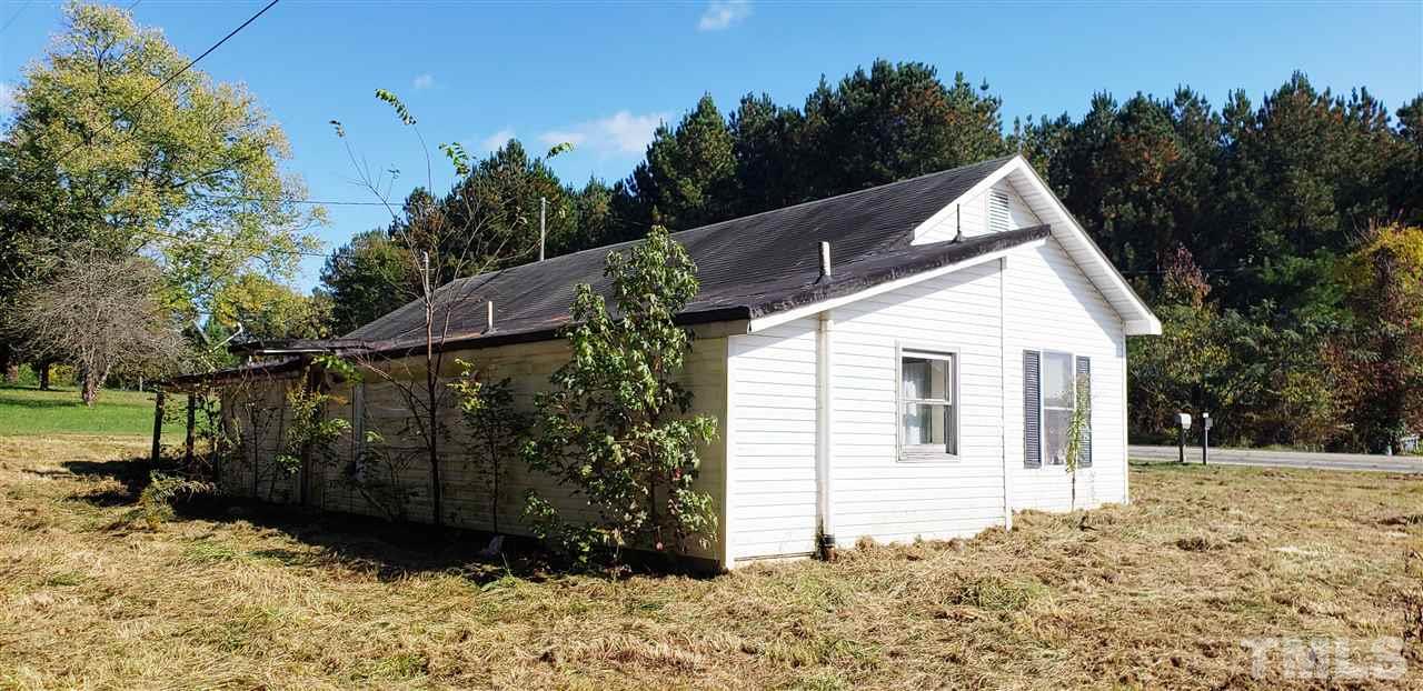 1195 Concord Ceffo Road Roxboro, NC 27574 - Photo 5 of 7 a view of a house with a yard