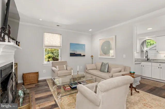 a living room with furniture fireplace and a flat screen tv
