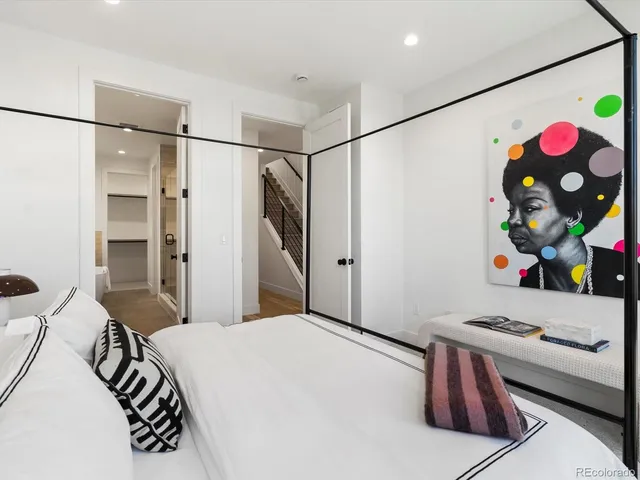 a bedroom with a bed and a couch