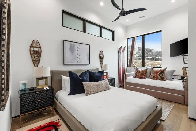a dining room with furniture a chandelier and window
