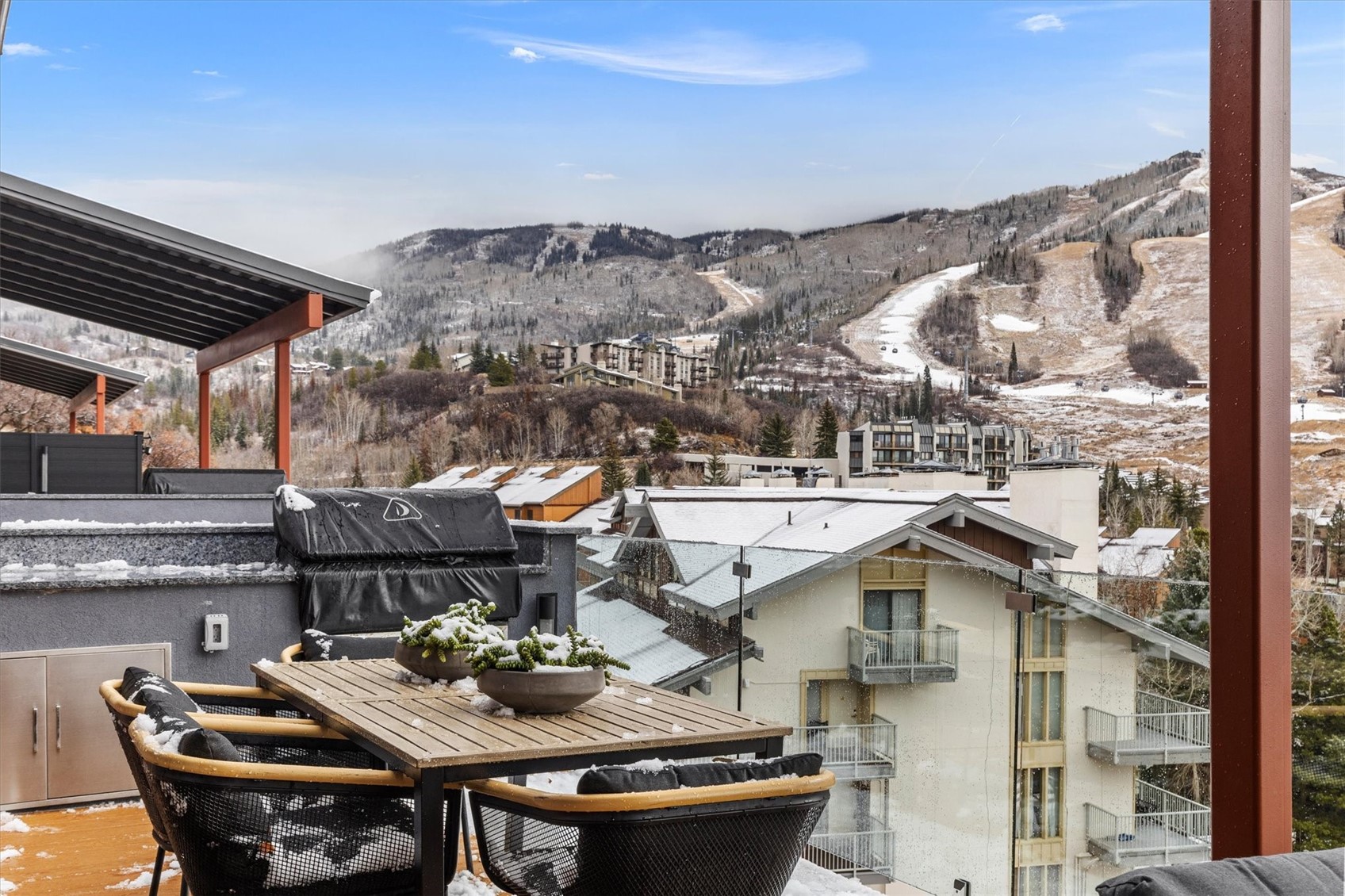 1855 Burgess Creek Road, Unit 4 Steamboat Springs, CO 80487 - Photo 18 of 42 a view of a terrace with furniture and a table