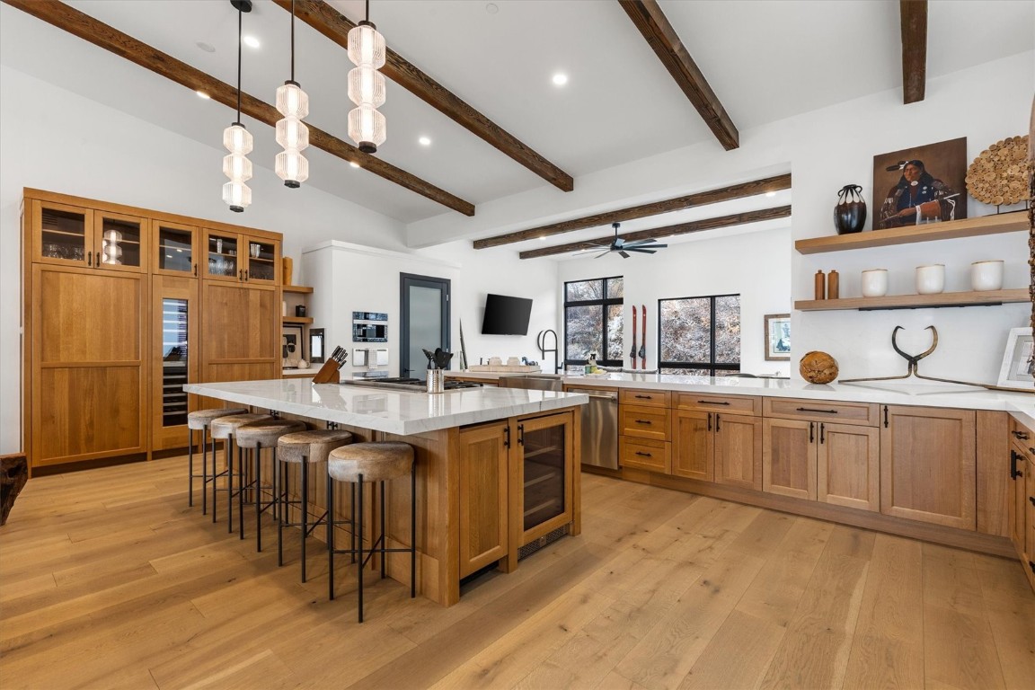 1855 Burgess Creek Road, Unit 4 Steamboat Springs, CO 80487 - Photo 2 of 45 a large kitchen with stainless steel appliances a sink and cabinets