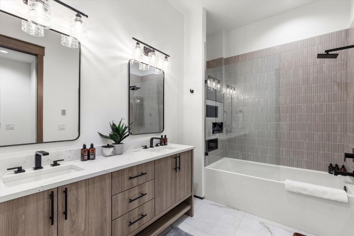 1855 Burgess Creek Road, Unit 4 Steamboat Springs, CO 80487 - Photo 22 of 45 a bathroom with a double vanity sink mirror double and bathtub