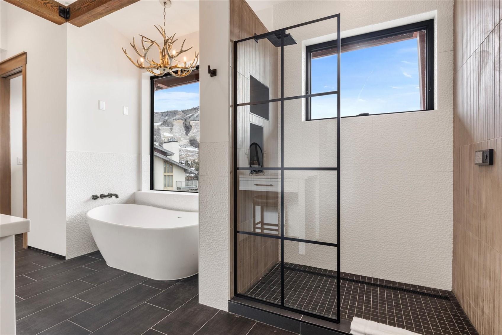 1855 Burgess Creek Road, Unit 4 Steamboat Springs, CO 80487 - Photo 28 of 42 a bathroom with a bathtub and shower