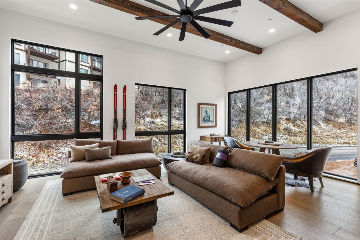 1855 Burgess Creek Road, Unit 4 Steamboat Springs, CO 80487 - Photo 3 of 45 a living room with furniture and a large window