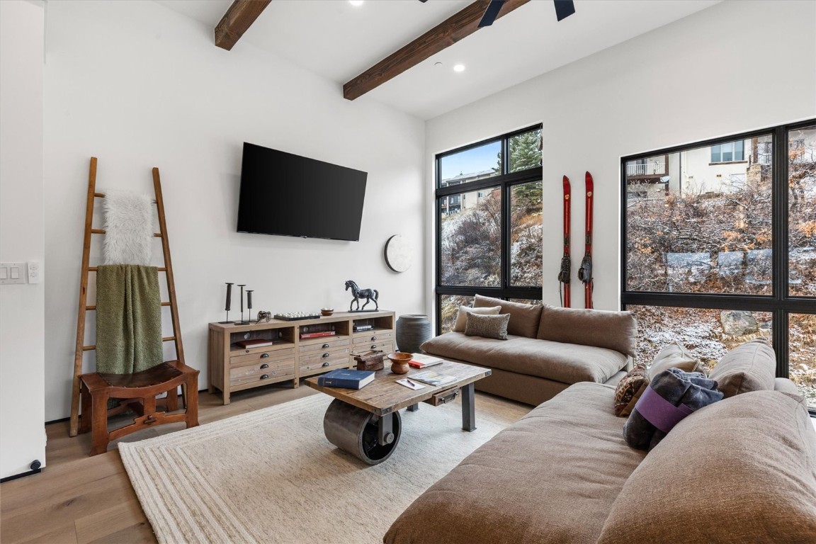 1855 Burgess Creek Road, Unit 4 Steamboat Springs, CO 80487 - Photo 32 of 45 a living room with furniture and a flat screen tv