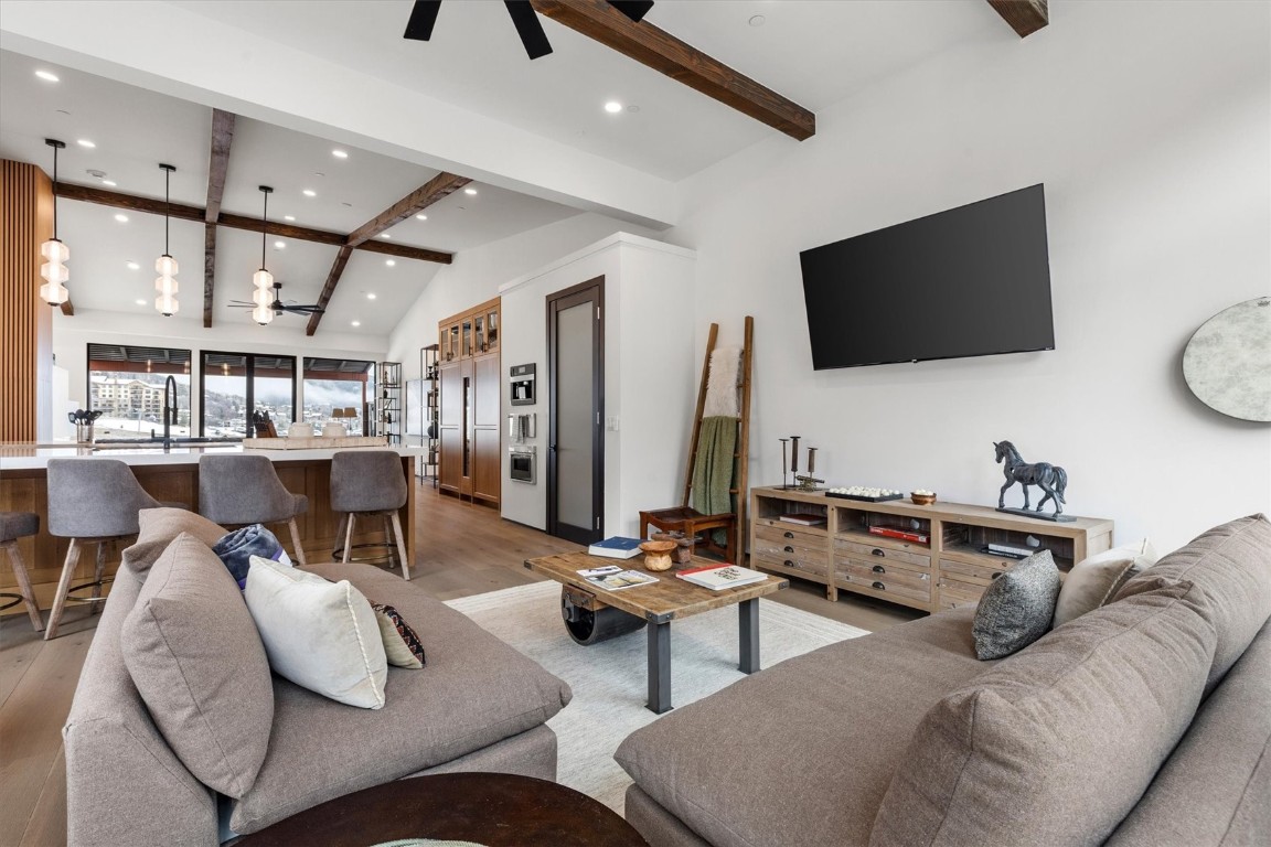 1855 Burgess Creek Road, Unit 4 Steamboat Springs, CO 80487 - Photo 34 of 45 a living room with furniture and a flat screen tv